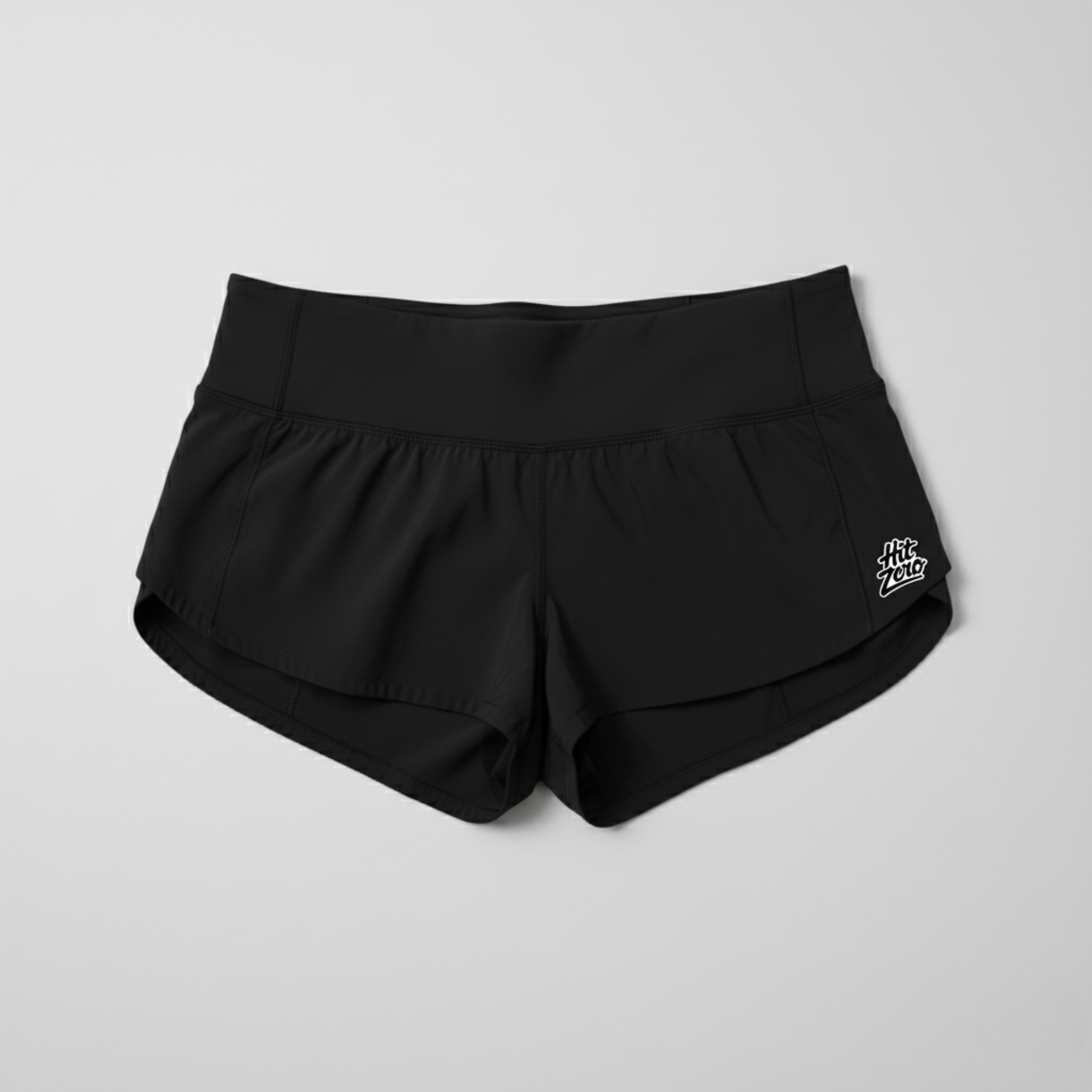 Low-rise Black cheer shorts (2.5" inseam) with wide black waistband and Hit Zero Athletics logo on the left leg.